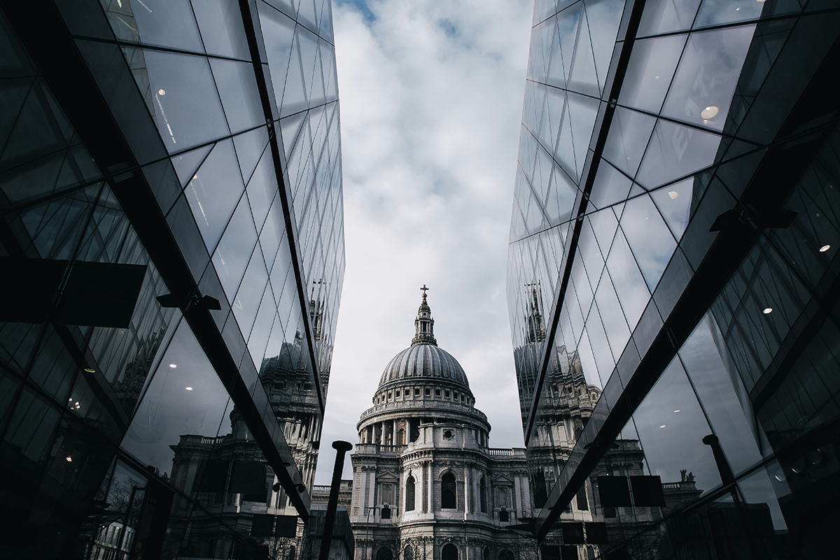 St Paul's Cathedral framed between glass office buildings in the City of London