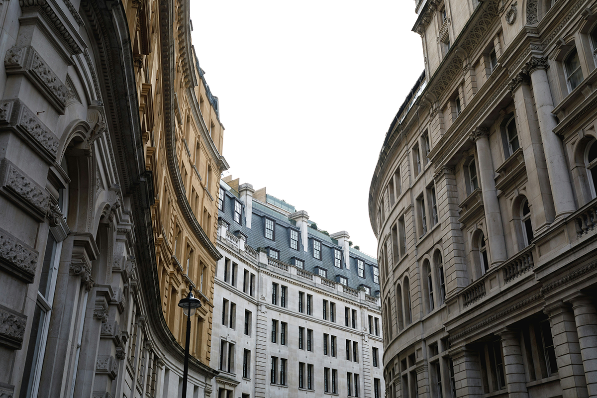 Classical London facades along a curving City street